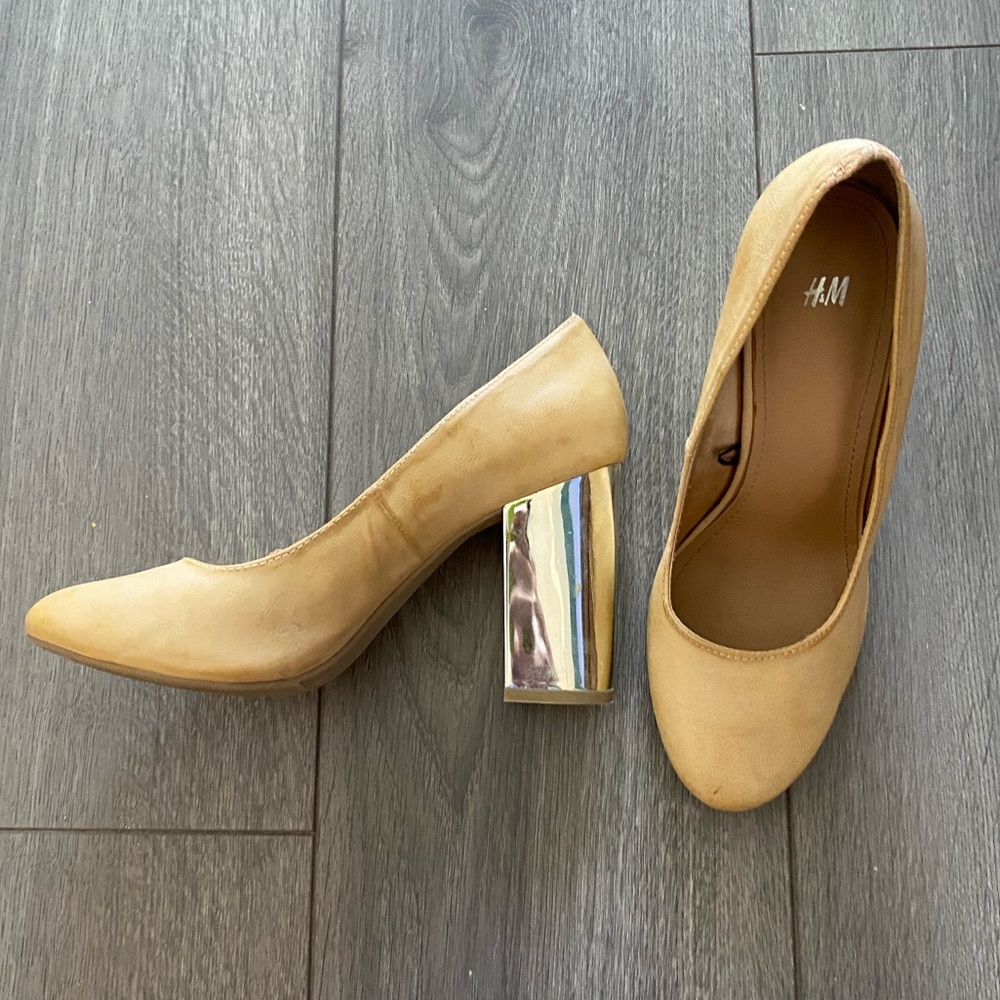 Stylish tan pumps with metal look heels